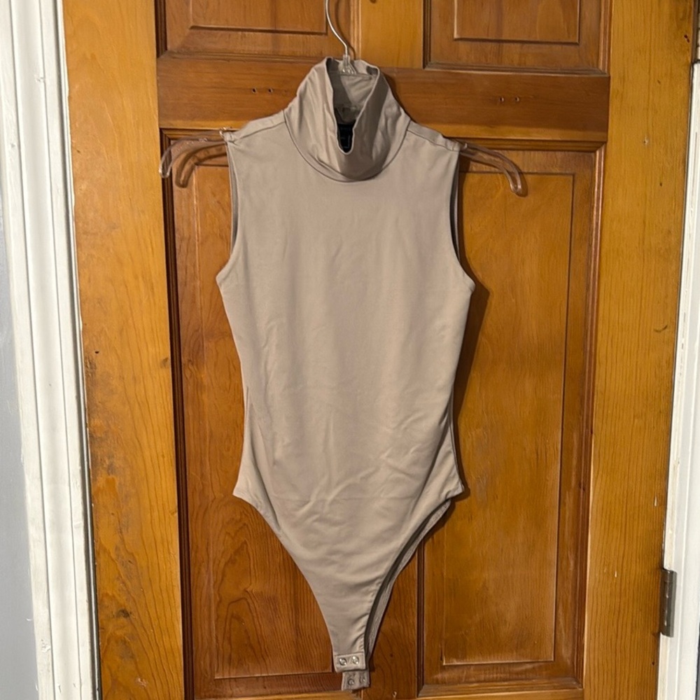 Woman’s Sleeveless Tan Bodysuit